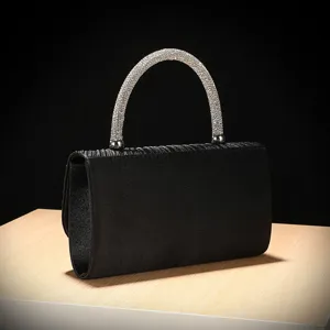 Black satin evening bag detail featuring sparkling crystal rhinestone rounded top handle.