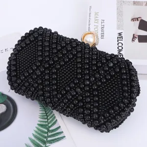 Black beaded evening clutch bag with elegant pearl rhinestone clasp for women party main view