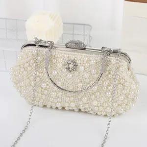 Elegant pearl evening clutch bag with rhinestone clasp and chain strap for women party dress.