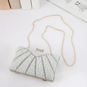 Elegant pearl evening clutch bag with chain strap, luxury style for party and wedding events detail.