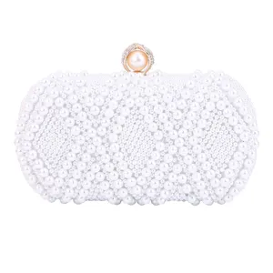 Elegant pearl evening clutch bag for women, stylish beaded wedding shoulder bag with chain.