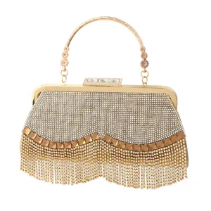 Sparkling rhinestone evening bag with elegant metal handle, luxury tassel clutch for party.