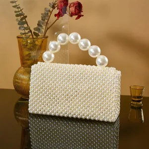 Handcrafted white faux pearl beaded evening handbag, elegant niche design for modern women.