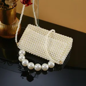 Handmade faux pearl evening bag detail, elegant beaded crossbody bag with luxury pearl handle.