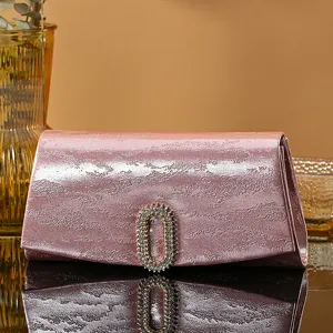 Chic pink rhinestone evening clutch bag with elegant oval crystal buckle for women.