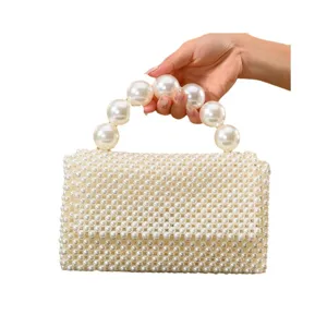 Exquisite handmade pearl beaded handbag detail showing elegant design and smooth texture.