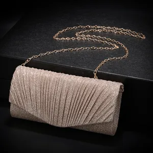 Detailed view of sparkly pleated evening clutch bag with chain strap for party and wedding.