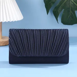 Elegant dark blue pleated evening clutch bag detailed view, perfect for party and formal wear.
