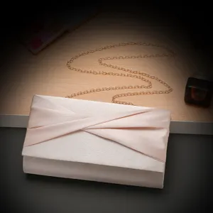 Chic champagne satin evening clutch bag with gold chain strap for elegant party wear details.