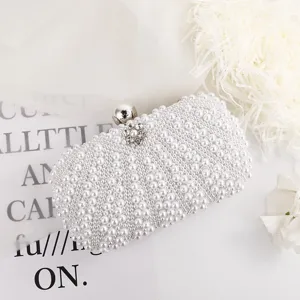 Elegant white pearl evening clutch bag detail, perfect accessory for wedding parties and banquets.