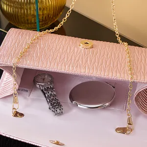 Pink pleated evening bag detail view, elegant clutch purse with gold chain strap for women.