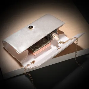 Detailed view of the interior capacity and exquisite satin finish of this elegant silver evening clutch bag.