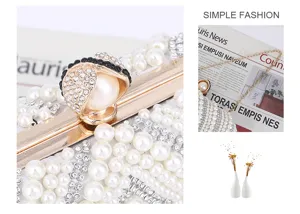 Elegant pearl evening clutch bag with full rhinestones and gold hardware for women.