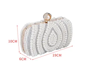 Elegant pearl evening clutch bag with rhinestones, luxury women handbag for party, detail view.