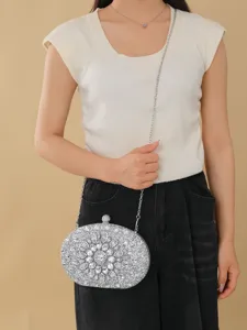 Elegant crystal rhinestone oval evening bag with chain strap for party and wedding dress.