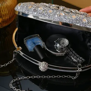 Stunning silver rhinestone evening clutch bag with chain strap, perfect for party and wedding.