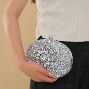 Elegant silver rhinestone evening clutch bag with sparkling crystals for party and wedding events.