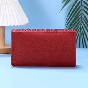 Elegant red pleated evening clutch bag for women, versatile and fashionable for parties.