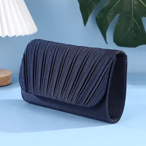 Exquisite dark blue pleated evening clutch bag, elegant design for banquets and parties.