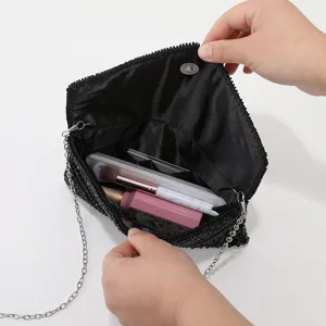 Black sequin evening clutch bag with metal chain strap, elegant party handbag for women.