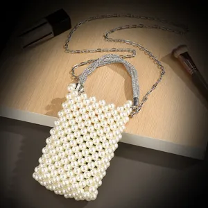 Pearl beaded mini phone bag detail showing rhinestone handle and delicate silver metal chain strap.