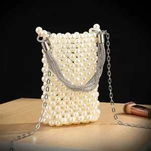 Pearl beaded phone bag detail view, stylish cross-body evening handbag with chain.