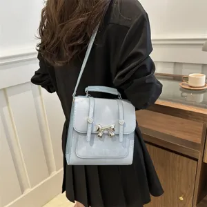 Zaino elegante azzurro con fiocco da donna, borsa a tracolla casual multifunzionale versatile.