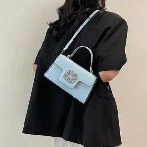 Bolso de mano azul claro elegante para mujer con hebilla brillante de estrás para uso diario.