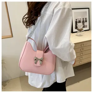 Roze lederen schoudertas voor dames, schattige strik en ketting stijlvolle okseltas dumpling tas.