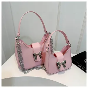 Stijlvolle roze lederen schoudertas set met zilveren strik en ketting voor dames chic dagelijks gebruik