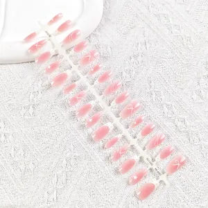 Set de uñas postizas largas cuadradas con degradado rosa, lazo blanco y diseño de estrellas.