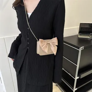 Fashion women's crossbody bag with elegant bow design, chic minimalist shoulder handbag.