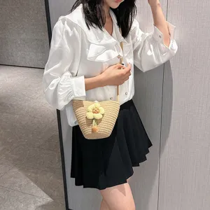 Summer woven mini bucket bag with cute yellow flower decoration for beach vacation and daily wear.