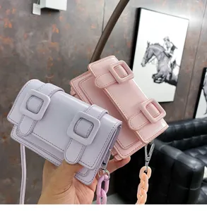 Candy color mini crossbody bag for women, stylish PU leather shoulder handbag with double buckle.