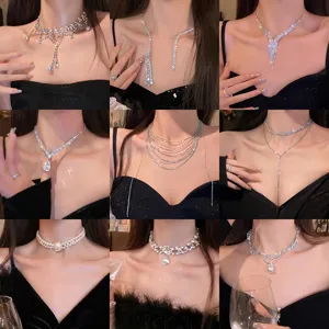 Detail shot of sparkling zircon rhinestone and pearl tassel collar necklace, elegant clavicle chain.