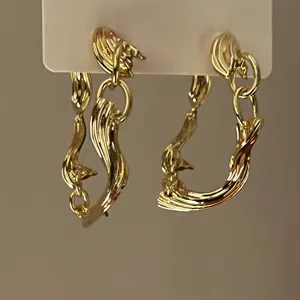 Exaggerated geometric metallic streamline earrings, stylish trend variant jewelry for women.