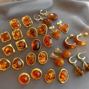 Vintage brown resin geometric earrings collection, gold plated elegant ear studs for women.