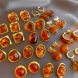 Amber resin geometric earrings detail, showcasing retro brown heart and oval shapes for women.