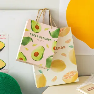 Cute avocado lemon printed paper gift bags for birthday party favors and fresh style packaging.