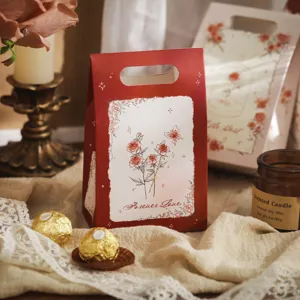 Red paper candy gift box with elegant rose and butterfly illustrations, perfect for parties.