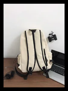 Korean style minimalist canvas backpack for men, casual student school bag with black straps.