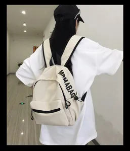 Minimalist casual canvas school backpack for women and students with letter print detail
