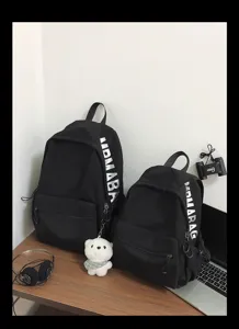 Minimalist black student backpack set with stylish side print, perfect for campus and daily use.