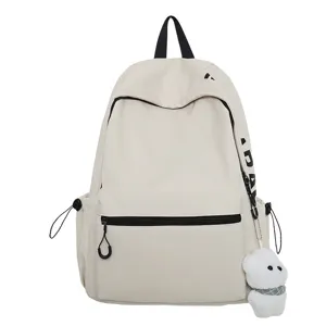 Minimalist beige student backpack with cute bear pendant, trendy daily casual school bag.
