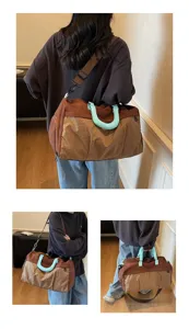 Large capacity travel duffel bag with grid pattern and stylish blue handle wrap for gym trips.