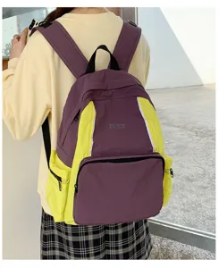 Detailed view of the stylish purple and yellow contrast backpack, perfect for daily casual use.