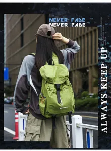 Detail view of casual green backpack outdoors, highlighting large capacity for daily travel.