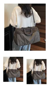 Large capacity travel duffel bag with stylish plaid pattern, versatile shoulder gym bag.
