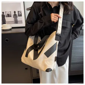 Japanese style canvas shoulder bag for women, casual crossbody tote with black contrast strap.