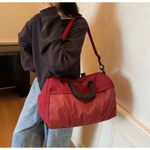 Large capacity gym duffel bag with grid pattern, short trip travel bag for daily fitness use.